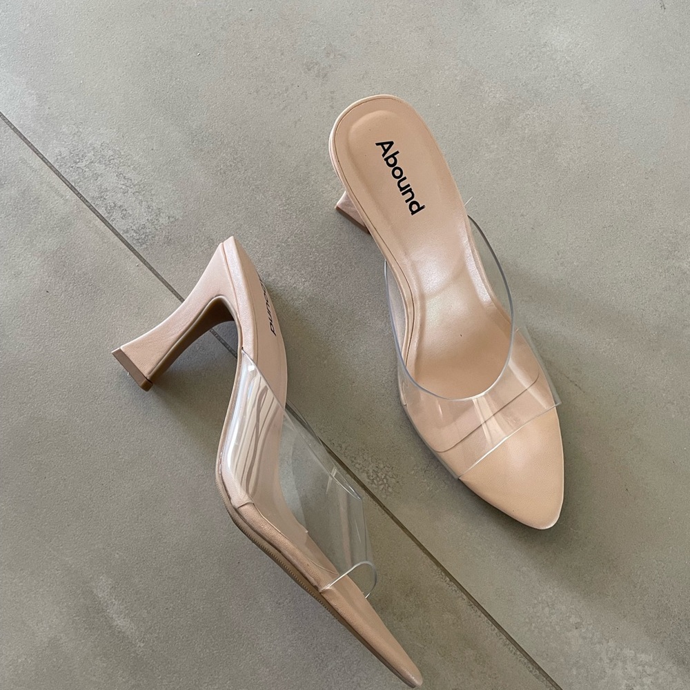 Abound nude heels featuring a modern clear PVC strap - size 7